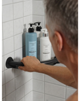 Luxworth corner shower caddy with integrated grab bar, showcasing durable shower shelf and safety grab rail in a bathroom setting.