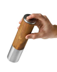 Ergonomic one-handed electric mill with natural wood and steel, ideal for indoor use by DK Household Brands.