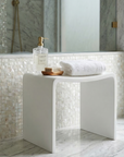 Luxworth minimalist stone shower seat with solid surface design, compact and modern bathroom stool for comfortable seating.