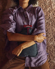 Luxworth Stoov Homey³ Original infrared heating pad with digital controls and soft fabric cover, shown in a cozy setting.