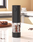 Electric Luxworth Easy-Grind salt and pepper mill set with sleek black and silver design, featuring adjustable grind knobs and clear chambers.