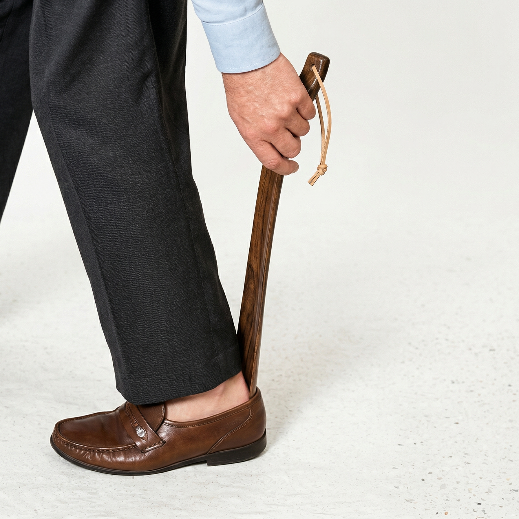 Hand-carved rosewood indoor shoehorn by Luxworth, showcasing smooth polished wood and elegant craftsmanship.