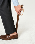 Hand-carved rosewood indoor shoehorn by Luxworth, showcasing smooth polished wood and elegant craftsmanship.
