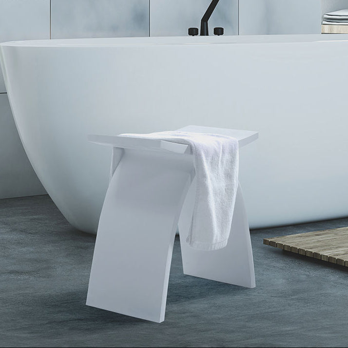 Luxworth stone arched shower stool with solid surface seat and sturdy legs, designed for bathroom seating and support.
