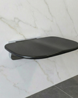 Modern Luxworth folding shower seat with a sleek design, featuring a sturdy seat and foldable frame for convenient bathroom use.