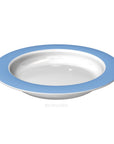 Small discreet sloped dining plate by Luxworth, an eating aid with a gentle slope for easier food intake, shown on a table.