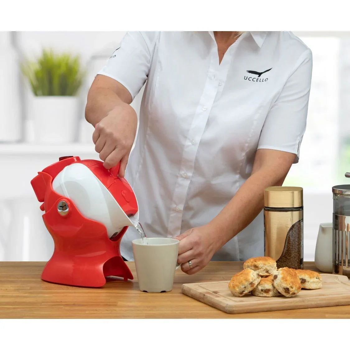 Luxworth Uccello Tipping Kettle, a stylish dining aid with a unique tipping design, shown on a countertop.