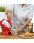 Luxworth Uccello Tipping Kettle, a stylish dining aid with a unique tipping design, shown on a countertop.