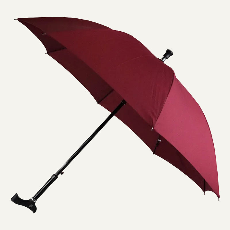 Maroon umbrella with black handle on a white background